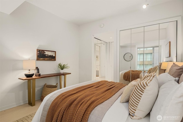 bedroom featuring a closet and baseboards