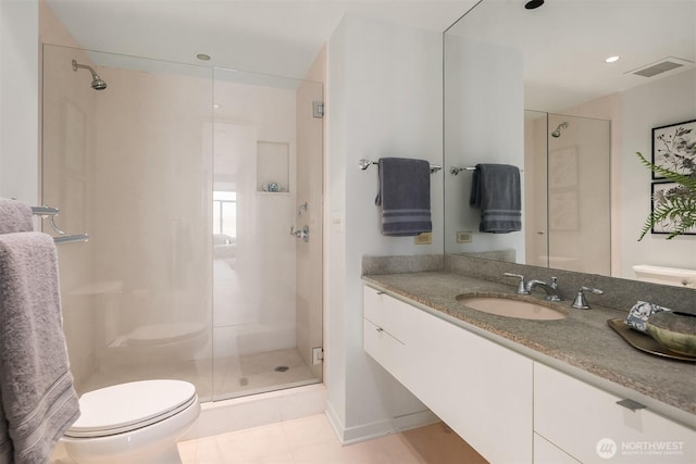 full bathroom featuring tile patterned flooring, toilet, visible vents, vanity, and a shower stall