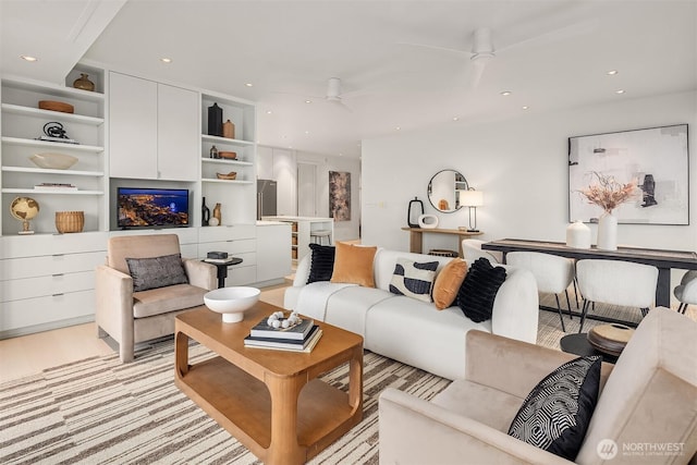 living room featuring ceiling fan and recessed lighting