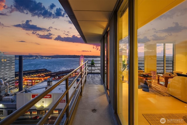 balcony featuring a water view