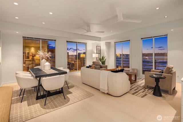 living room featuring a ceiling fan and recessed lighting