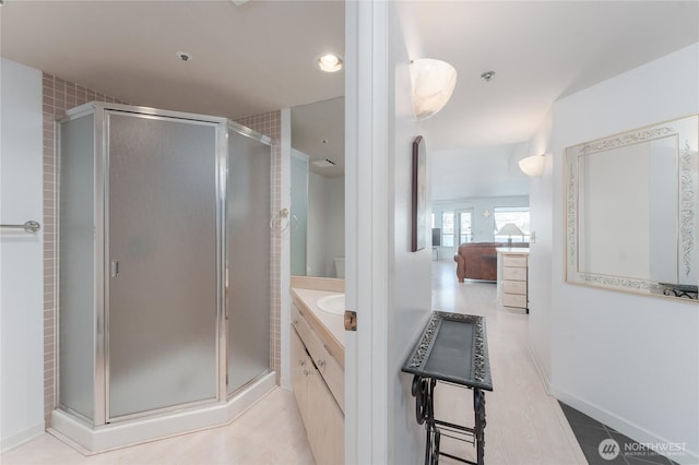 bathroom featuring vanity and an enclosed shower