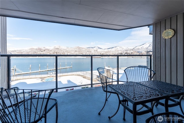 balcony with a water and mountain view