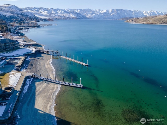 bird's eye view with a water and mountain view