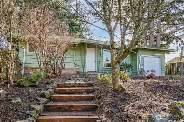 view of front of property with a garage