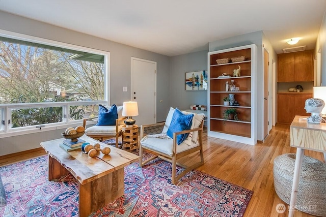 sitting room featuring light hardwood / wood-style floors