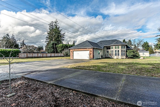 view of side of home featuring a garage and a yard