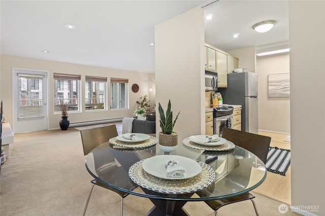 dining room with light carpet