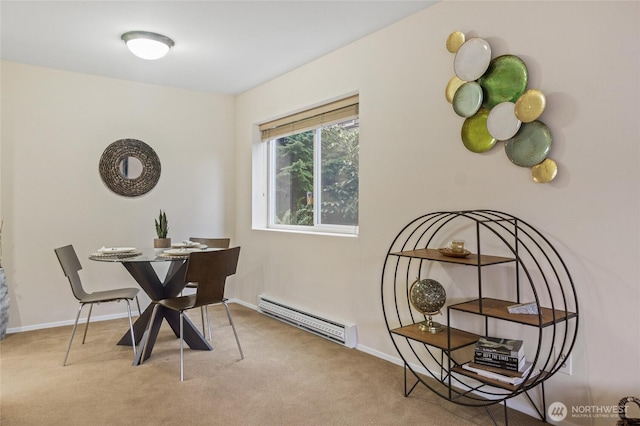 carpeted dining area with a baseboard radiator