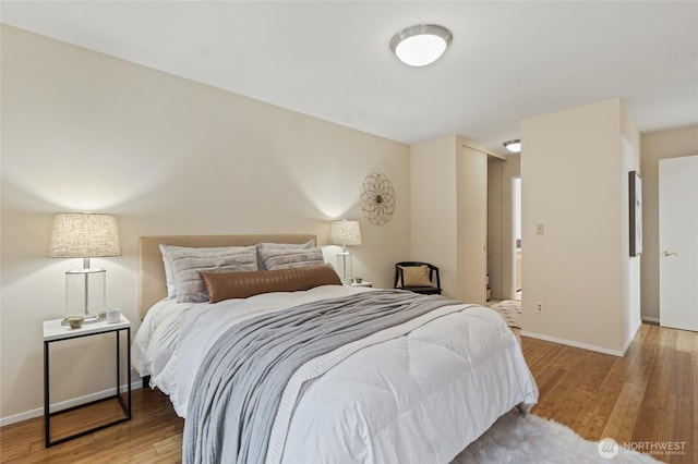 bedroom with wood-type flooring