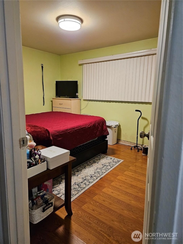 bedroom featuring wood-type flooring