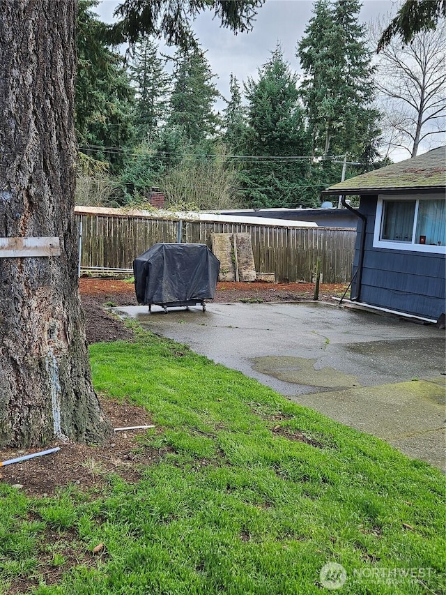 view of yard with a patio and fence