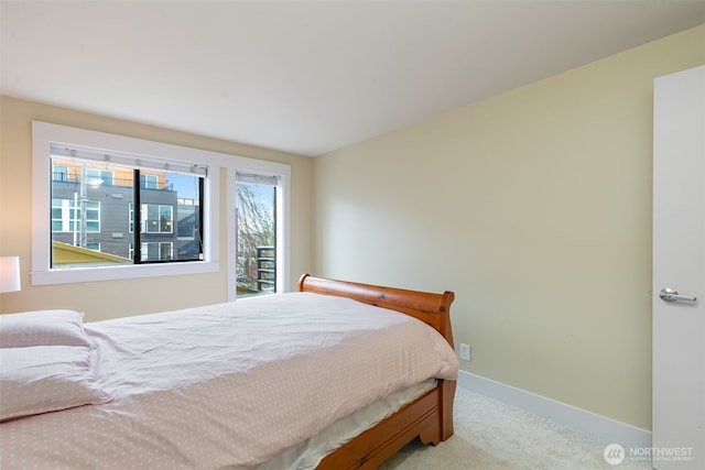 bedroom featuring carpet flooring and baseboards