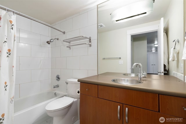 bathroom featuring toilet, shower / bath combo, and vanity