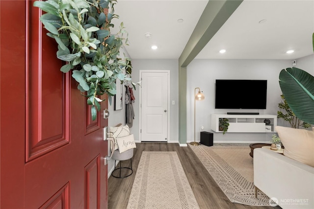 entryway featuring dark wood-style floors, baseboards, and recessed lighting