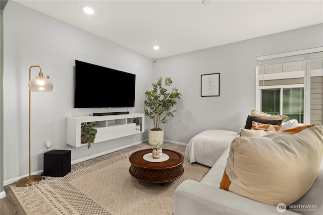 living room with recessed lighting and baseboards