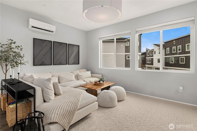 living area with carpet floors, baseboards, and a wall mounted AC