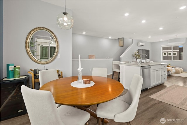 dining space featuring dark wood-style floors, a wall mounted air conditioner, stairs, and recessed lighting