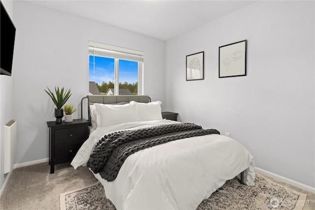 bedroom featuring carpet floors and baseboards