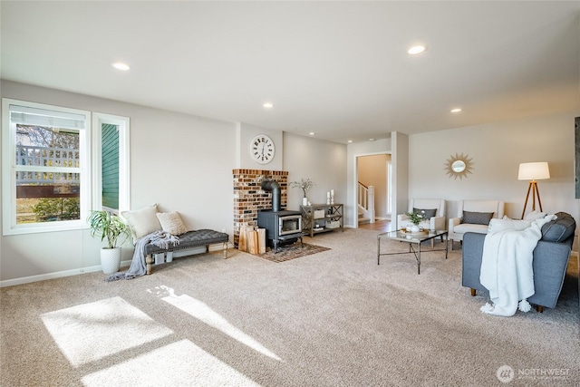 carpeted living room featuring a wood stove