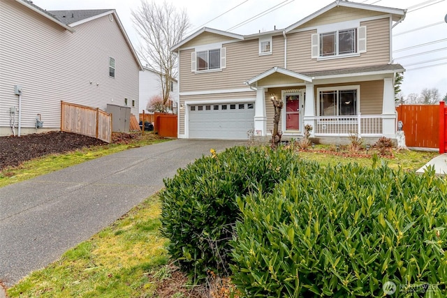 view of front of house with a garage and a porch