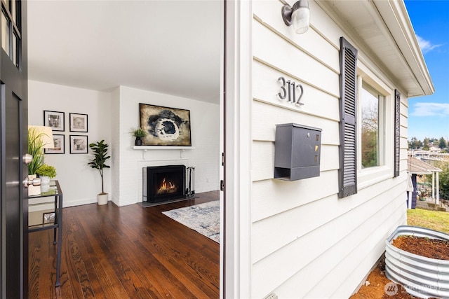 exterior space featuring a fireplace with flush hearth