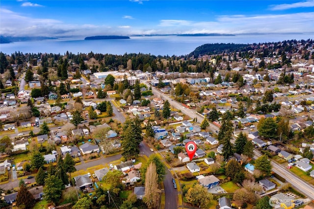 birds eye view of property with a water view and a residential view