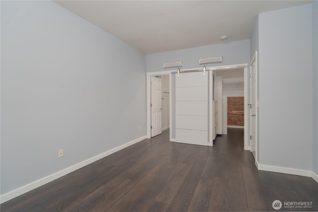 unfurnished bedroom featuring dark hardwood / wood-style flooring