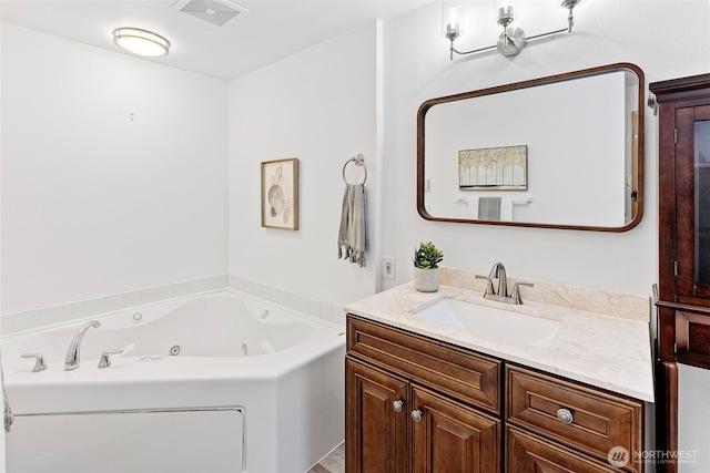 bathroom with vanity and a bathtub