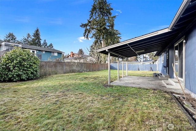 view of yard with a patio area and a fenced backyard