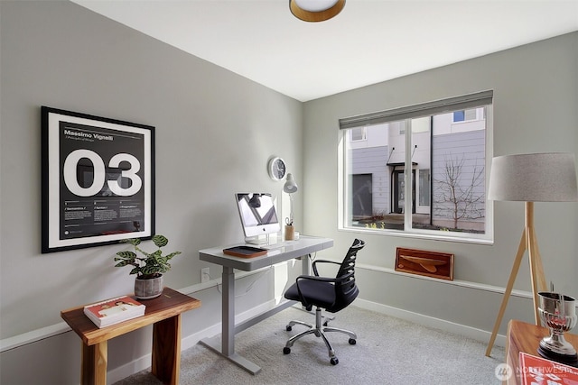 office featuring light carpet and baseboards