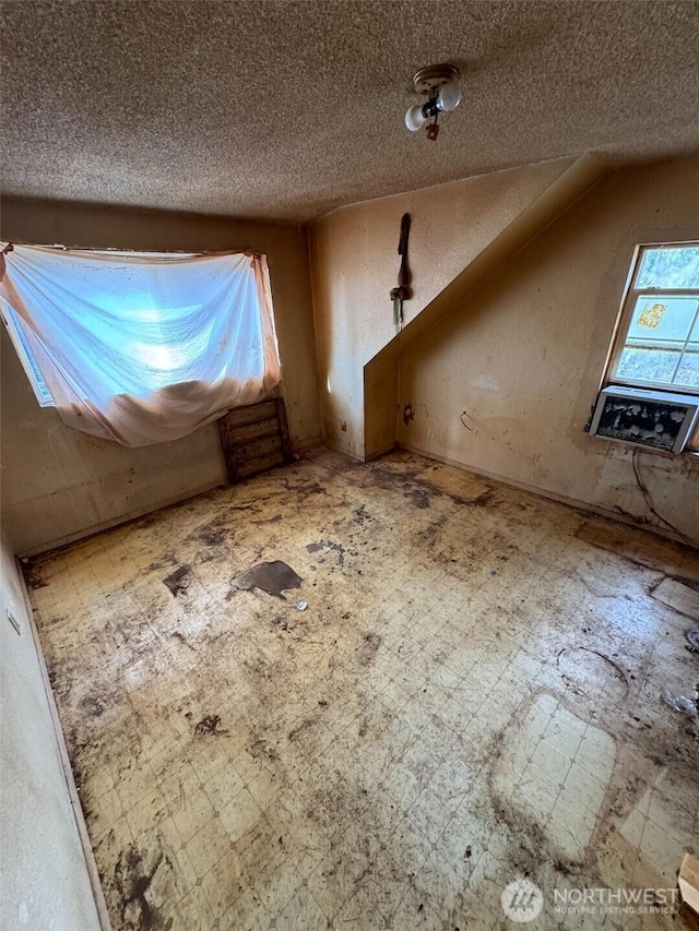 interior space featuring a textured ceiling