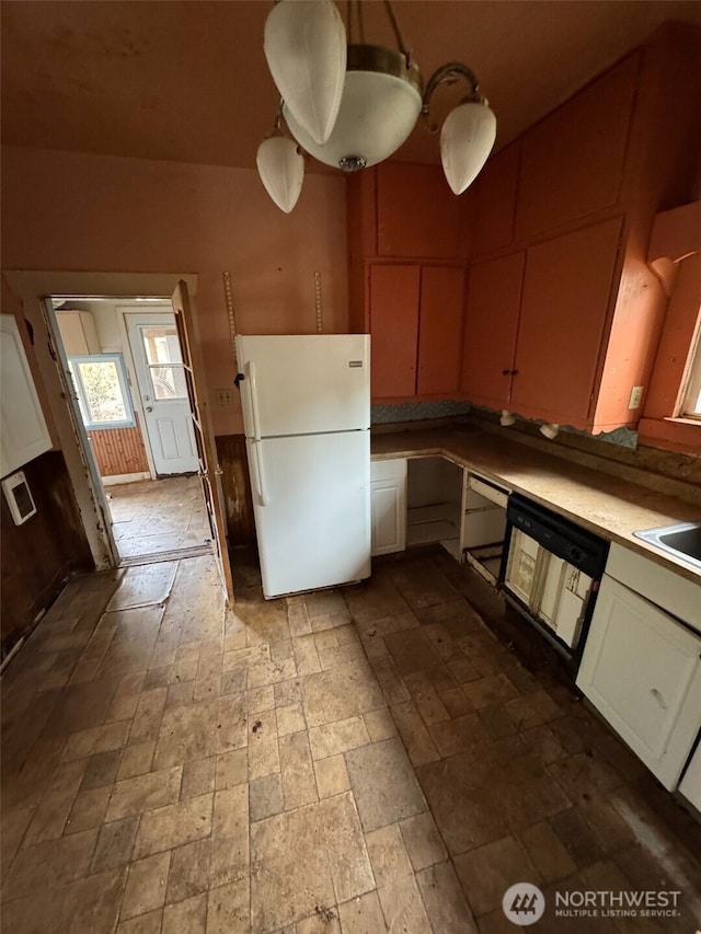 kitchen with white fridge and dishwasher