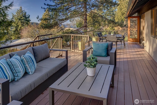 wooden deck featuring an outdoor hangout area