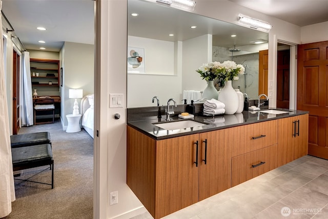 bathroom with vanity and a shower