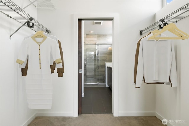 spacious closet with carpet floors and visible vents