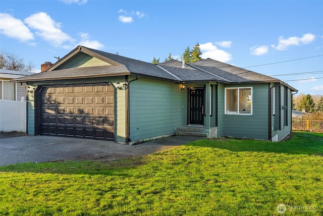 single story home with a chimney, an attached garage, fence, driveway, and a front lawn