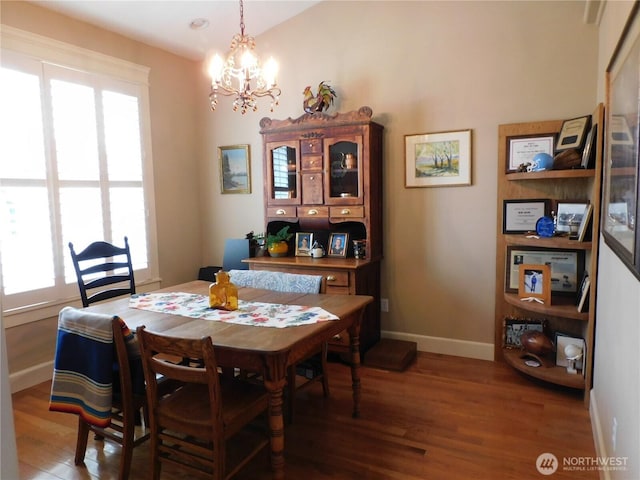 2611 Sea Crest Ave N, Long Beach, WA 98631 - dining space featuring wood finished floors and a chandelier