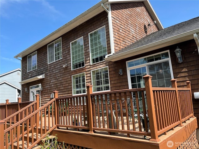 2611 Sea Crest Ave N, Long Beach, WA 98631 - rear view of house with a wooden deck and a shingled roof