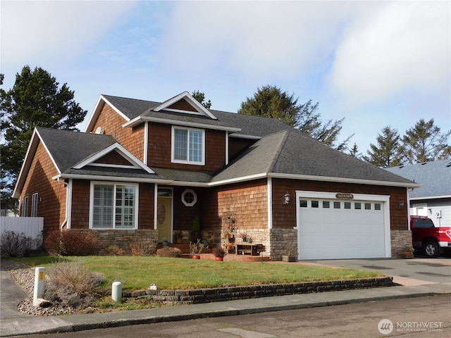 view of front of house with a front lawn, stone siding, driveway, and an attached garage