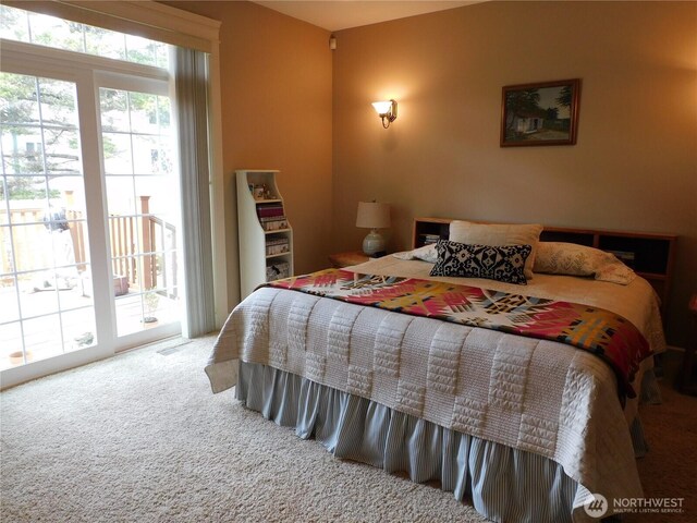 carpeted bedroom featuring access to outside