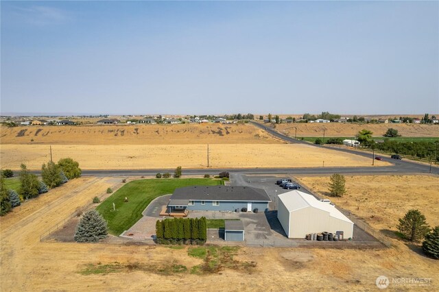 birds eye view of property featuring a rural view