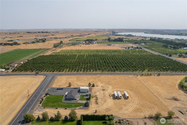 bird's eye view with a water view and a rural view