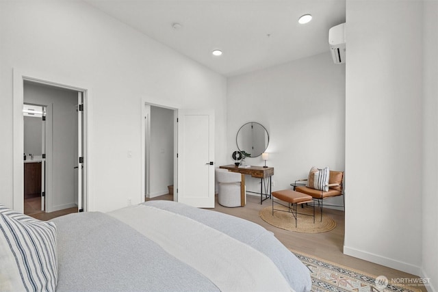 bedroom with high vaulted ceiling, wood finished floors, a wall unit AC, recessed lighting, and baseboards