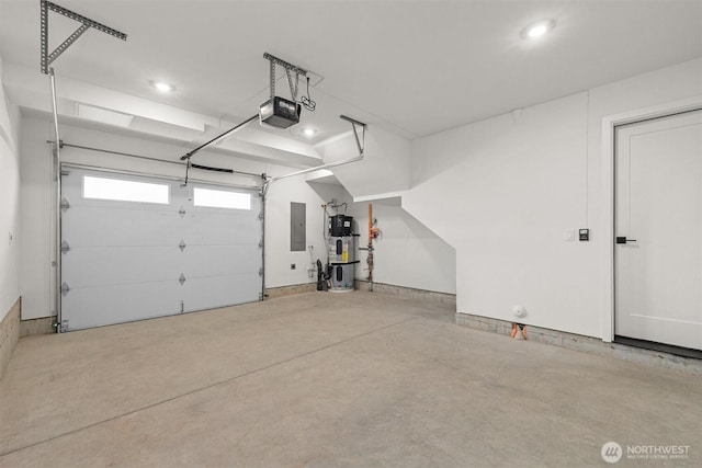 garage with electric panel, a garage door opener, and hybrid water heater