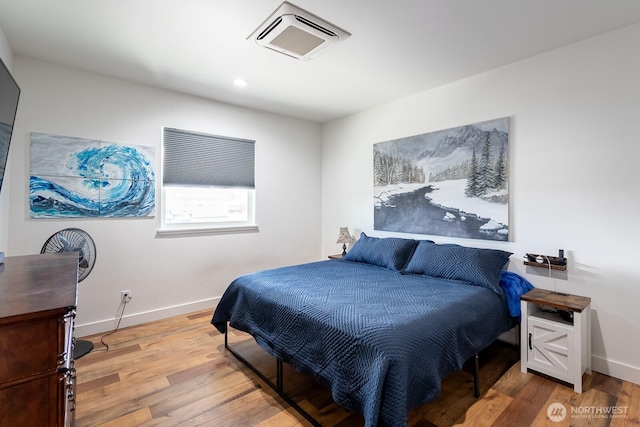 bedroom featuring hardwood / wood-style floors