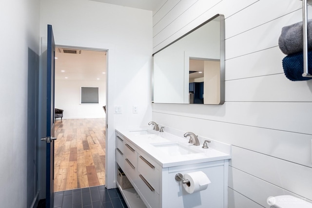 bathroom featuring hardwood / wood-style flooring and vanity