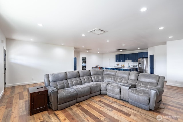 living room with light hardwood / wood-style flooring