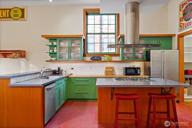 kitchen with island range hood, a kitchen island, glass insert cabinets, stainless steel appliances, and open shelves