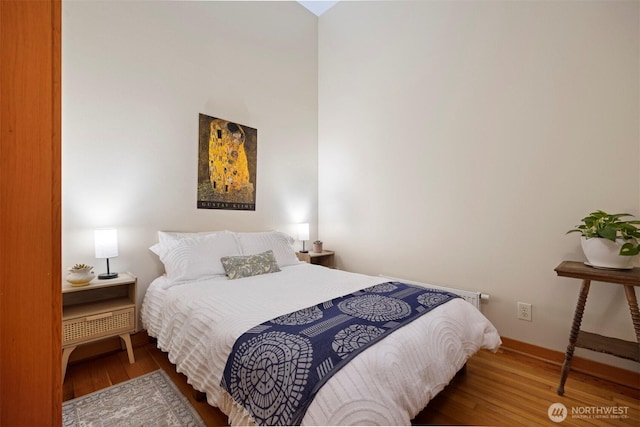 bedroom with wood finished floors